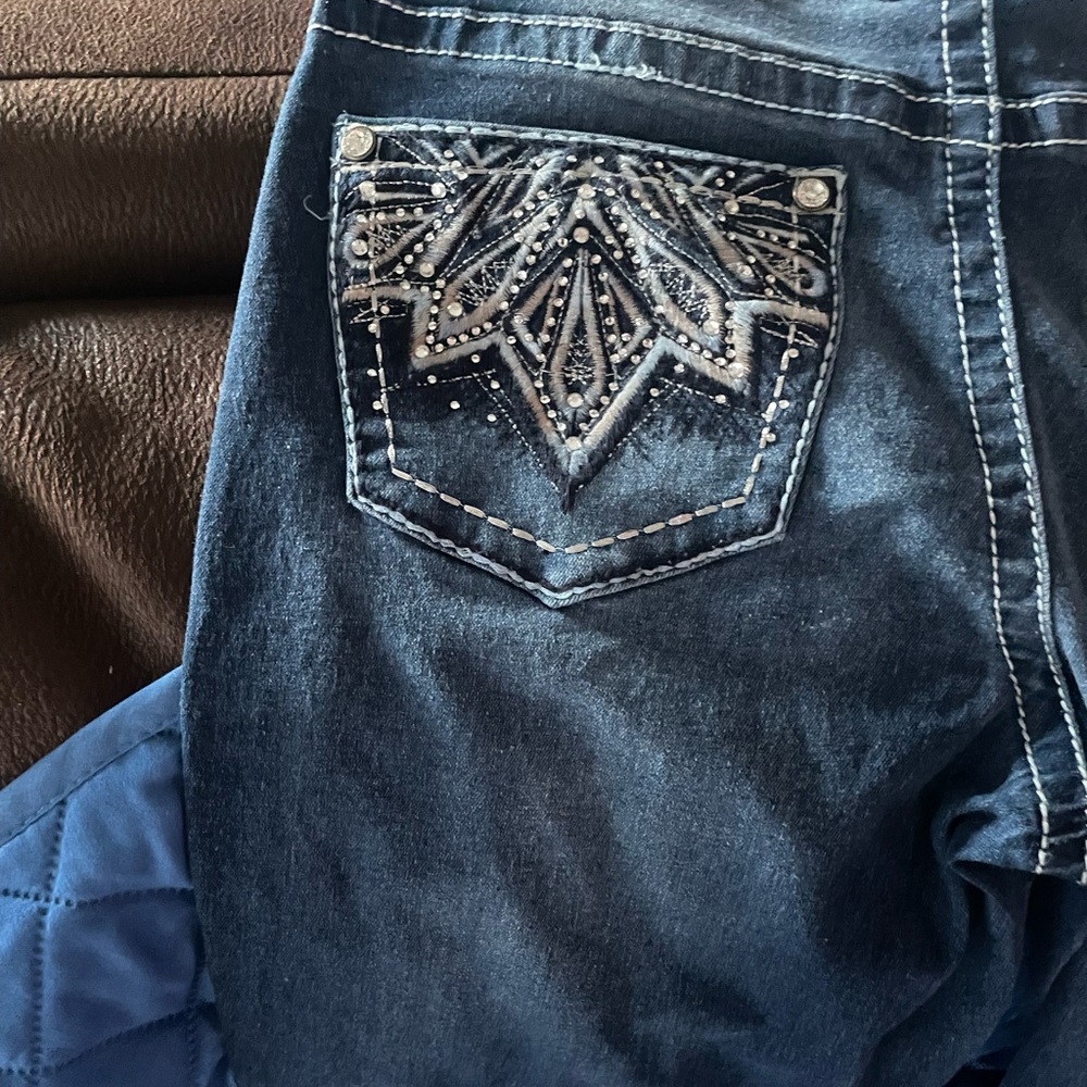 bootcut jeans with design on back pockets